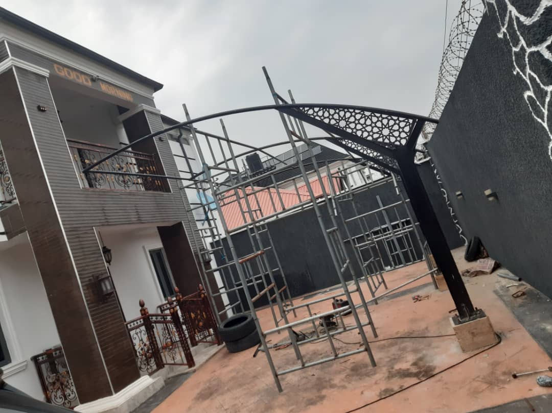 Entrance arch and site scaffolding for a custom residential frontage.