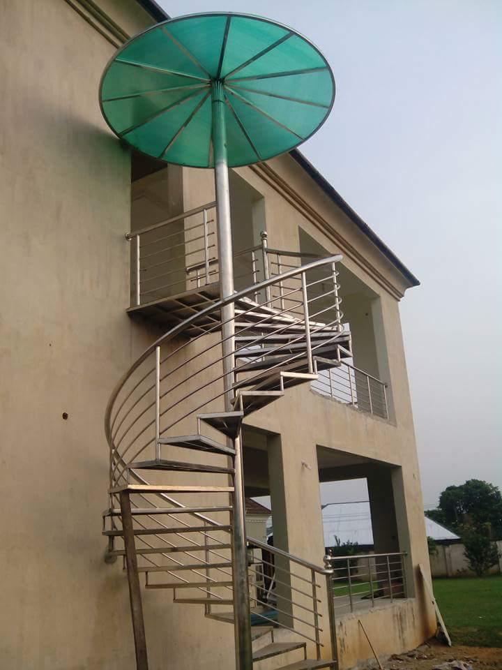 Outdoor spiral staircase installed on a multi-storey home.